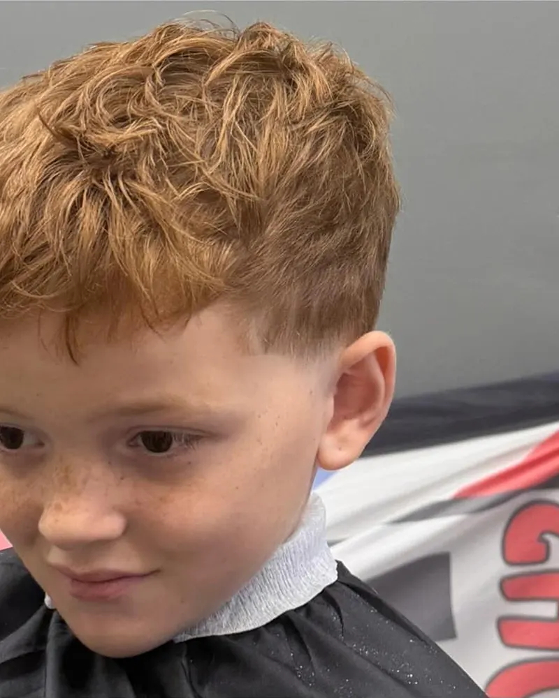 Kids' haircut with a textured top and low fade